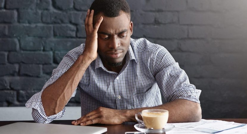 unhappy african businessman feeling stressed frustrated